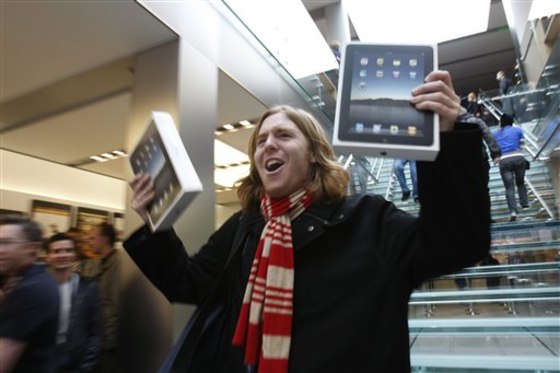 In this April 3, 2010 photo, Andres Schobel holds up two iPads as one of the first customers to buy iPads on the first day of Apple iPad sales at an Apple Store in San Francisco. The consumer electronics industry needs that kind of product success in the year ahead.